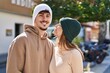 © Krakenimages.com - Mand and woman couple smiling confident standing together at street