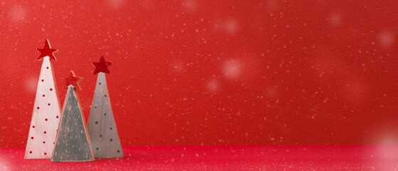 Aufkleber - Merry christmas with xmas tree at vivid red wall at wooden table with snow.copy space for adding design