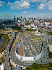 Wall Mural - Aerial vertical view of Brisbane city and highway traffic in Australia in daytime