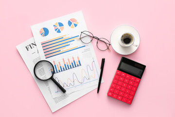 Poster - Business charts, cup of coffee and stationery on pink background