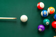 © Pixel-Shot - Colorful billiard balls with cue on table