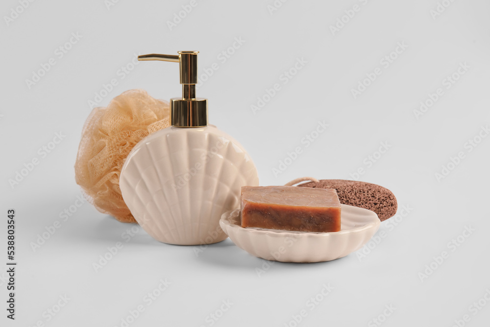 Bath accessories with soap on white background