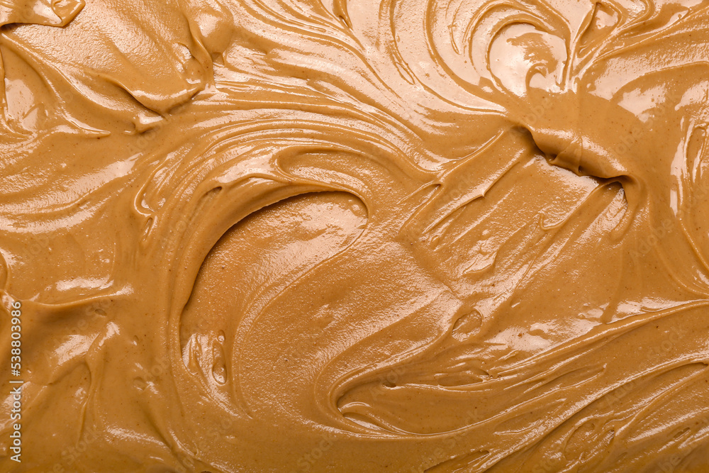 Texture of nut butter as background, closeup