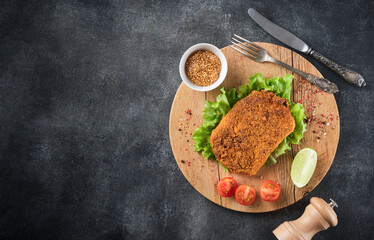 Poster - Pork cutlet with vegetables, top view.