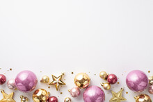 Christmas Decorations Concept. Top View Photo Of Stylish Gold Violet And Pink Baubles Star Ornaments And Confetti On Isolated White Background With Copyspace