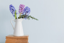 Hyacinth Flowers In Vase On Old Books