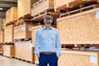 © Westend61 - Businessman wearing virtual reality simulator standing with hands in pockets by thermal insulated containers