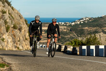 Cyclists Cycling At Costa Blanca Mountain Pass On Sunny Day In Alicante, Spain