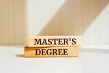 Fototapeta  - Wooden blocks with words 'Master's Degree'.