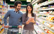 © Minerva Studio - Couple shopping in a supermarket