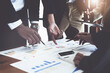 © Jirapong - The company's businessmen meet and discuss to plan a marketing strategy and come to a conclusion on how to use the financial budget to avoid investment risks