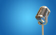 Vintage Microphone isolated on blue banner with copy space