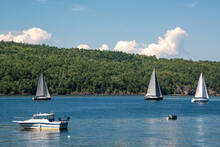 Boats At Mooring And Sailboats Sailing In Willsboro Lake Champlain Bay