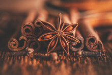 Close-up Christmas Spices, Star Anise, Cinnamon Sticks, Cloves. Side View, Selective Focus. Toned Image.