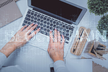 Poster - Double exposure of woman hands working on computer and blockchain theme hologram drawing. Top View. bitcoin cryptocurrency concept.