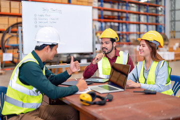 Group of worker in the warehouse factory conduct toolbox talk daily meeting focus on safety priority and house keeping in the morning before start working