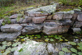 Fototapeta Lawenda - Close-up view of rocks on the shore of Beau Rivage Island