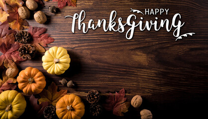 Wall Mural - thanksgiving and autumn decoration composition. pumpkin, pine cone, autumn leaves and the text on da