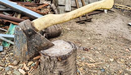 Ax and ax handle. Woodworking. Deforestation with a sharp axe. Ax to chop wood.