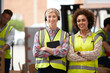 © Monkey Business - Portrait Of Two Female Workers Using Headsets In Distribution Warehouse With Digital Tablet