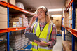 © Monkey Business - Female Worker Wearing Headset In Logistics Distribution Warehouse Using Digital Tablet