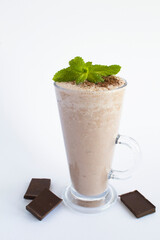 Wall Mural - Chocolate cocktail in the drinking glass on the white background. Close-up. Location vertical.