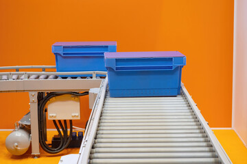 Poster - warehouse conveyor. storage logistics automation. blue containers are moving along conveyor. modern 