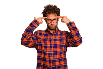 Wall Mural - Young caucasian curly hair man isolated Young caucasian man with curly hair isolated focused on a task, keeping forefingers pointing head.