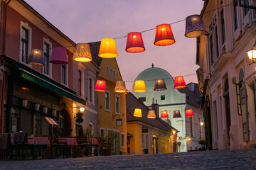 Main square with beautiful city lights in Szentendre Hungary next to Budapest with colorful banner light decorations