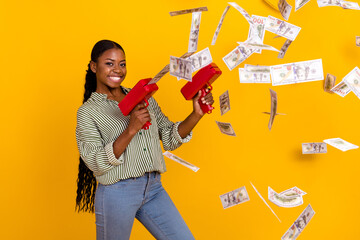 Wall Mural - Photo of successful cheerful girl shoot usd banknotes toothy smile isolated on yellow color background