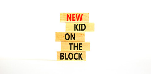 New kid on the block symbol. Concept words New kid on the block on wooden blocks. Beautiful white table white background. Business and new kid on the block concept. Copy space.