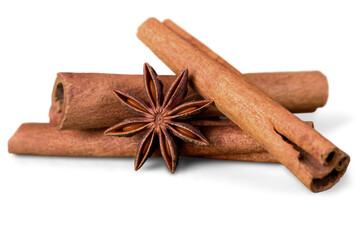 Poster - Cinnamon sticks and star anise on white background isolated