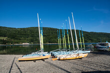 Many Sailboats Lined Up On The Beach
