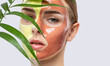 canvas print picture - Beautician makes a face mask of a woman to rejuvenate the skin. Cosmetology treatment of problem skin on the face and body.