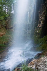 Wall Mural - Waterfall of the Molino de la Chorrera in Cuenca mountain range natural park, Spain - long exposure view