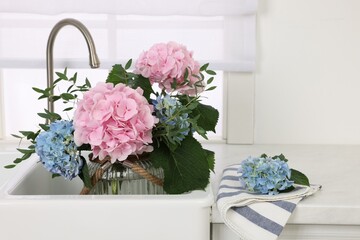 Sticker - Vase with beautiful hortensia flowers in kitchen sink