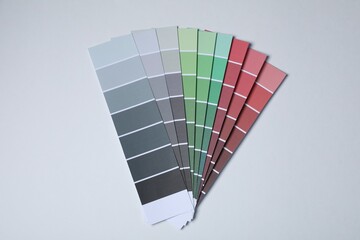 Poster - Color paint chips on light background, top view