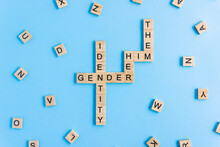 Words Gender Identity And His, Her And Them Made Up Of Wooden Blocks With Letters. Pronouns Gender Concept.