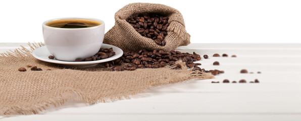 Canvas Print - Cup of hot coffee with beans on background