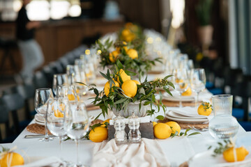 Wall Mural - Festive table at the wedding party decorated with lemon arrangements