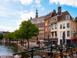 Cityscape image of old typical Dutch buildings along canals in Leiden town of South Holland province