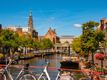 Scenic View Of Canals,boats And Ancient Buildings Of Dutch City Of Leiden, Province Of South Holland