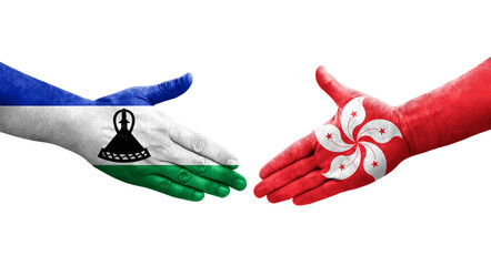 Handshake between Hong Kong and Lesotho flags painted on hands, isolated transparent image.