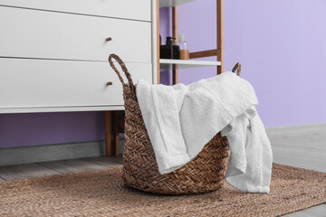 Poster - Laundry basket with towel in bathroom