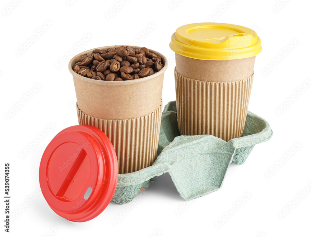 Holder with paper cups of coffee beans on white background