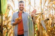 © Serhii - Farmer in field checking on corncobs