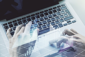 Poster - Multi exposure of abstract financial graph with hand typing on laptop on background, financial and trading concept