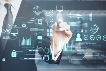 Poster - businessperson hand pointing at creative glowing business chart interface hologram on blurry office interior background. Company digital data, guide and computer analysis concept. Double exposure.