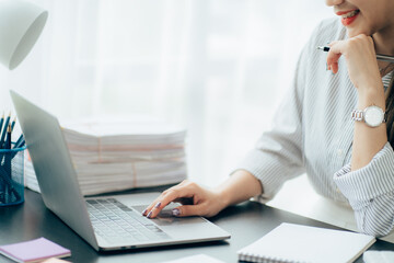 Close up of Business team analyzing income charts and graphs with modern laptop computer. Business analysis and strategy concept.