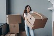 © VK Studio - Tired female tenant carrying box with things leaving rented apartment. Eviction, hard relocation day